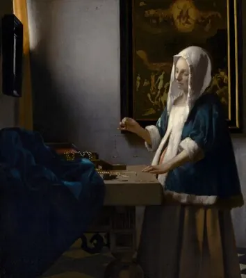 Woman Holding a Balance — Johannes Vermeer